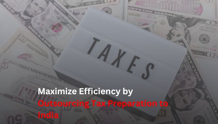 Lightbox with the word "TAXES" placed on scattered US dollar bills, symbolizing the concept of outsourcing tax preparation to India.